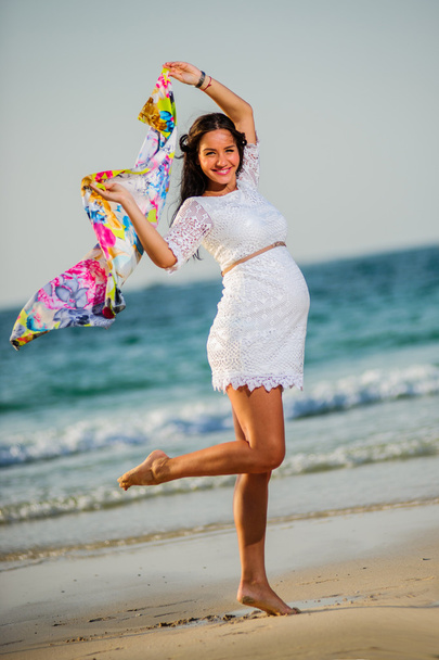 Portrait of yang beautiful European pregnant girl on the sea coast. - Φωτογραφία, εικόνα