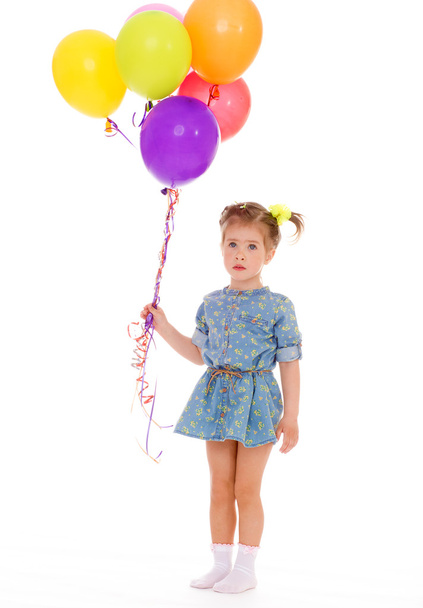 Charming girl with balloons. - Φωτογραφία, εικόνα