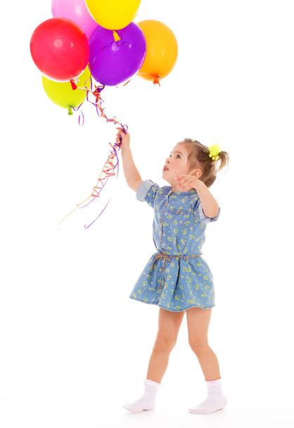Charming girl with balloons. - Фото, изображение