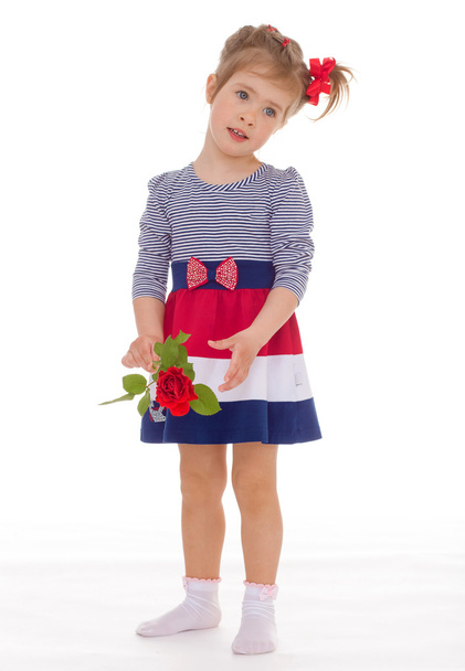 Fashionable little girl with a rose. - Φωτογραφία, εικόνα