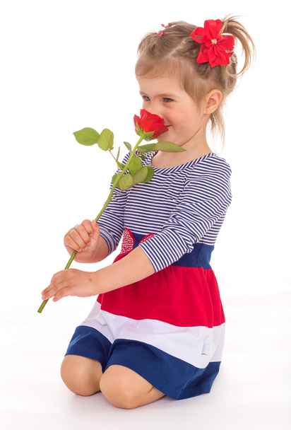 Fashionable little girl with a rose. - Foto, imagen