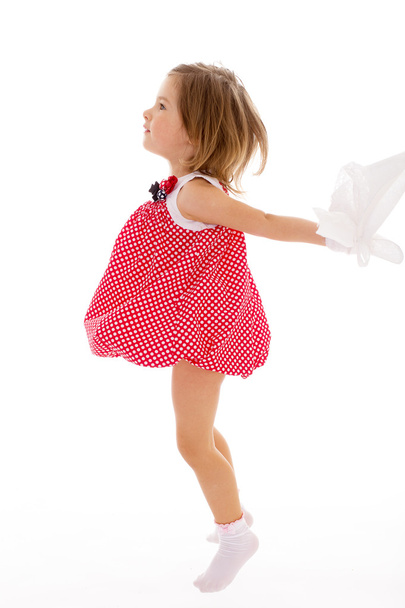 Fashionable little girl in a pink dress. - Фото, изображение