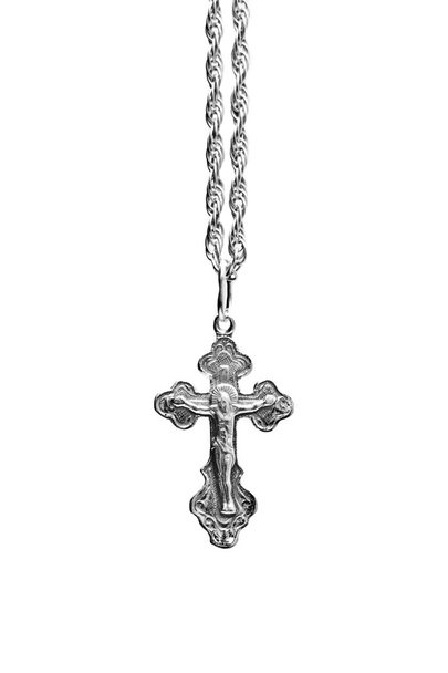 Cross on a chain on a white background close - Фото, изображение