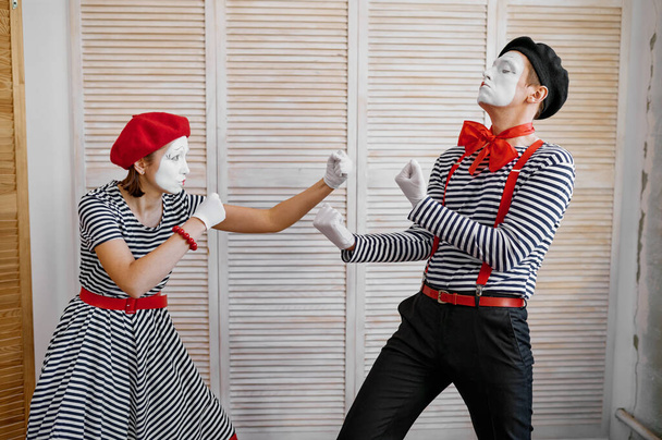 Two clowns, mime artists, boxing parody, comedy. Pantomime theater, comedian, positive emotion, humour performance, funny face mimic and grimace - Photo, Image