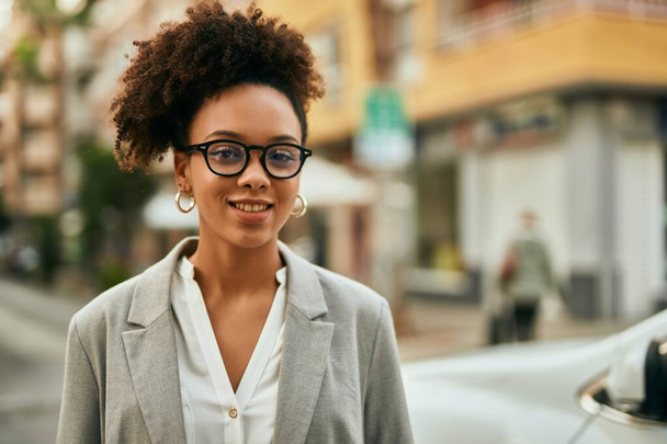 Young african american businesswoman smiling happy standing at the city. - Photo, Image