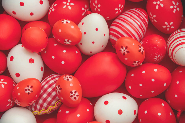 Easter eggs collection red and white color background, top view. Happy Easter greeting card. Christian religion holiday celebration and decoration. - Foto, immagini