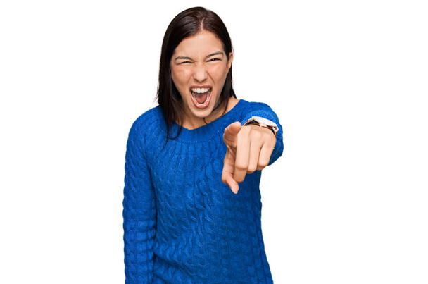 Young hispanic woman wearing casual clothes pointing displeased and frustrated to the camera, angry and furious with you  - Photo, image