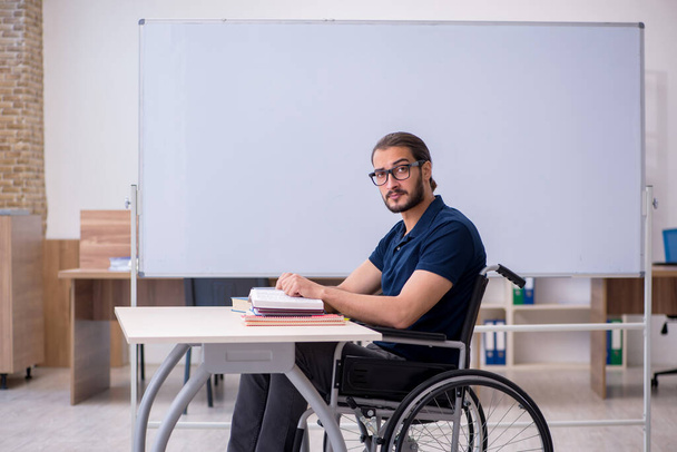 Young male handicapped student in the classroom - Photo, Image