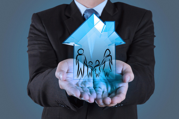 businessman hand holding 3d house as insurance concept - Photo, Image