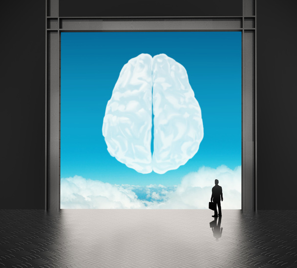 homem de negócios olhando para o cérebro como conceito de ícone de nuvem
 - Foto, Imagem