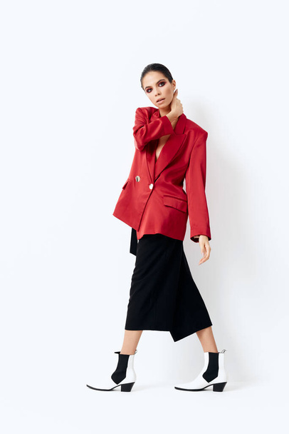 brunette in red blazer fashion clothes studio posing model - Foto, Bild