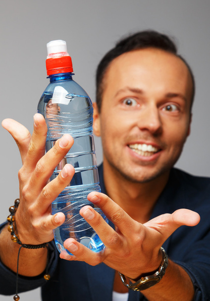 Man with bottle of water - Φωτογραφία, εικόνα