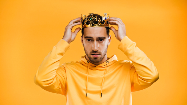 man wearing golden crown isolated on yellow - Photo, Image