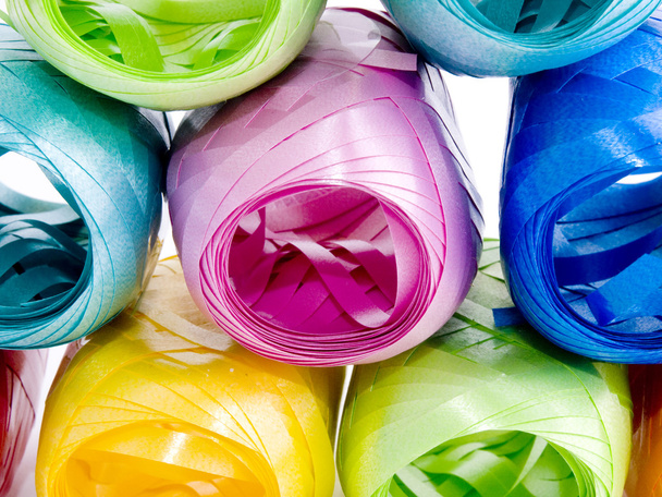 Closeup picture of colorful hanks of ribbons on white background. - Photo, Image