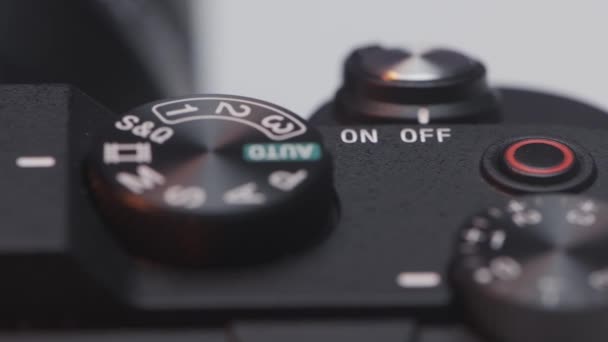 Close up of DSLR camera buttons and dials. Action. Details of a new professional camera on white background. - Πλάνα, βίντεο