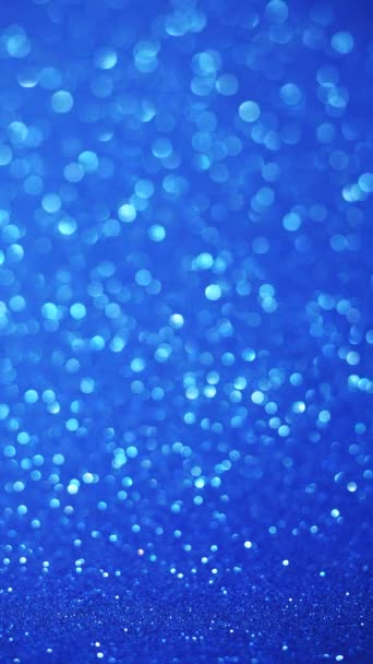 Pystysuora sininen glitter tausta hämärtää ja bokeh - Materiaali, video
