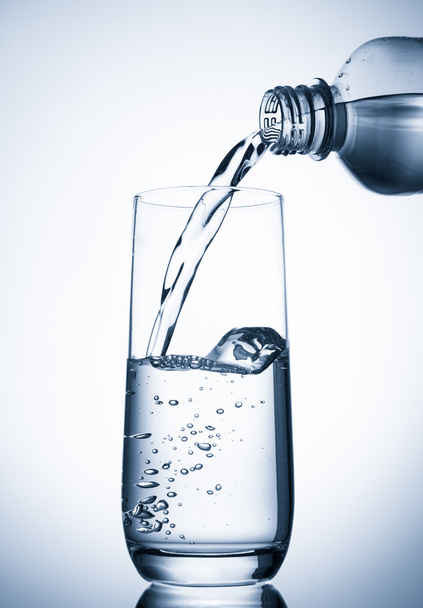 Pouring water into glass - Photo, Image