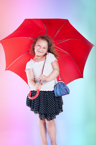 Pretty little girl with umbrella. - Foto, Imagem