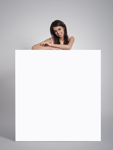 Woman leaning on empty whiteboard - Photo, Image