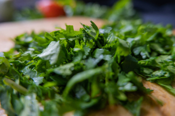 Close-up of chopped coriander on a cutting board - Photo, Image