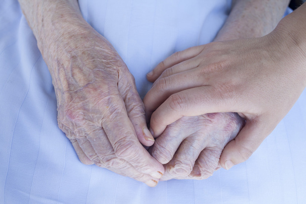 Elderly and young woman hands - Photo, Image