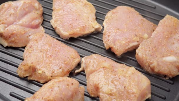 raw chicken fillet on a grill pan. cooking food. Chicken pieces - Footage, Video