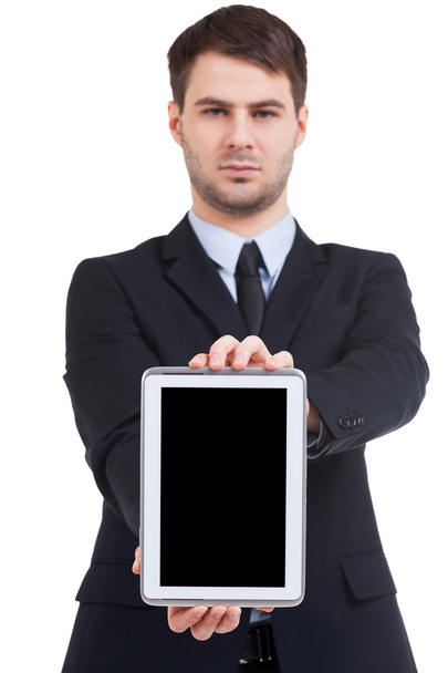 Man in formalwear showing his digital tablet - Zdjęcie, obraz
