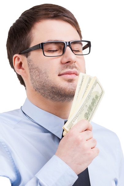 Man in shirt and tie holding paper currency - Photo, Image