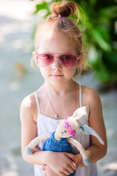 Little girl with a toy - Photo, image