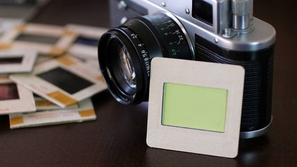 Vintage film camera and slide film 	 - Photo, Image
