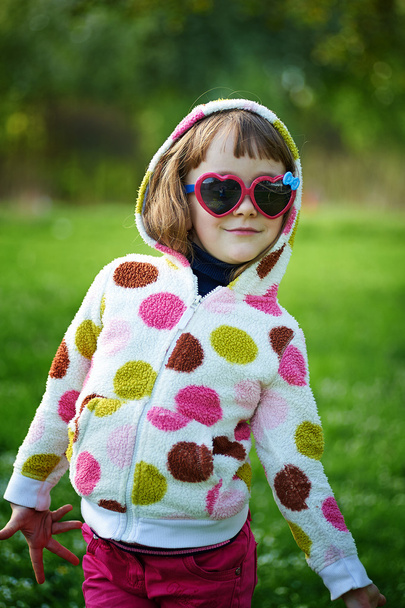 little girl in sunglasses - Фото, изображение