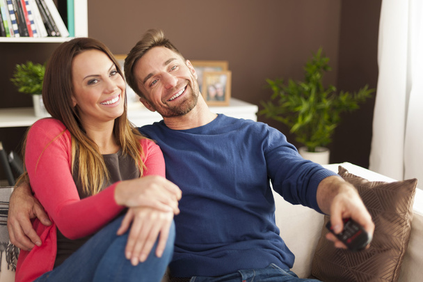 Couple watching tv at home - Photo, image