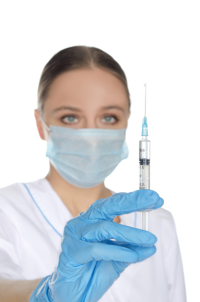 Doctor about a syringe - Foto, Imagem