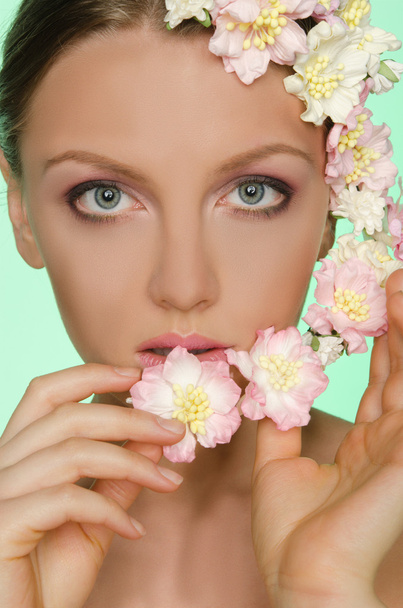 Young beautiful women with flowers - 写真・画像