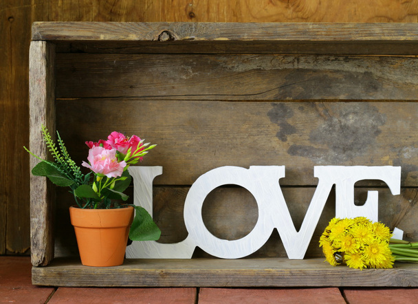 Word love made of white wooden letters on vintage background - Photo, Image