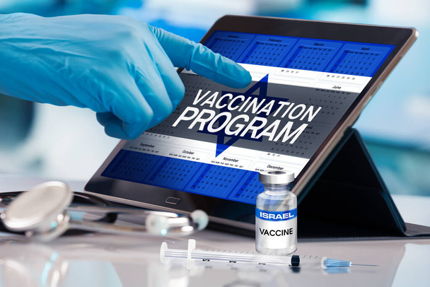 Professional working in calendar of vaccines plan for Israel nation, Immunization concept. Working with tablet in the program of the vaccination schedule for Israel. Photomontage with 3d illustration - Photo, Image