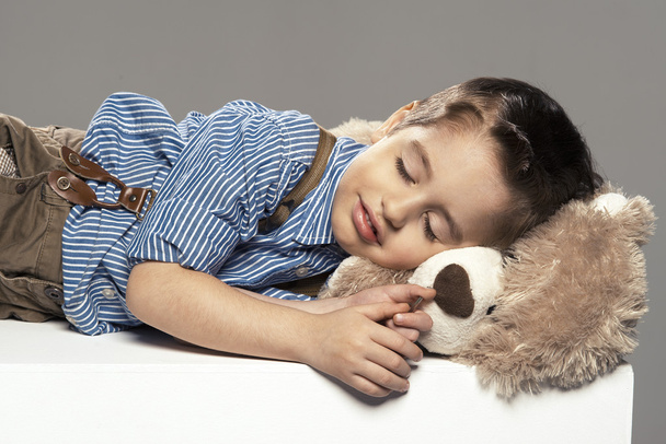 Portrait of small boy sleep with bear - Photo, Image