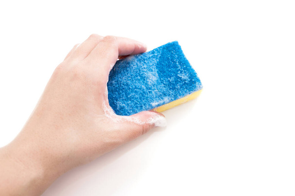 Premium Photo  Blue plate with pink dish sponge in hand on