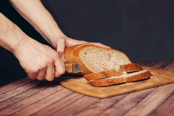 slicing loaf on a cutting board wooden table kitchen food flour product - Photo, Image