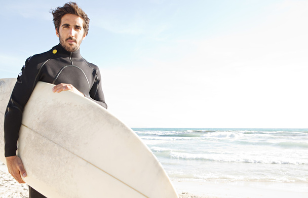 Young attractive surfer standing - 写真・画像