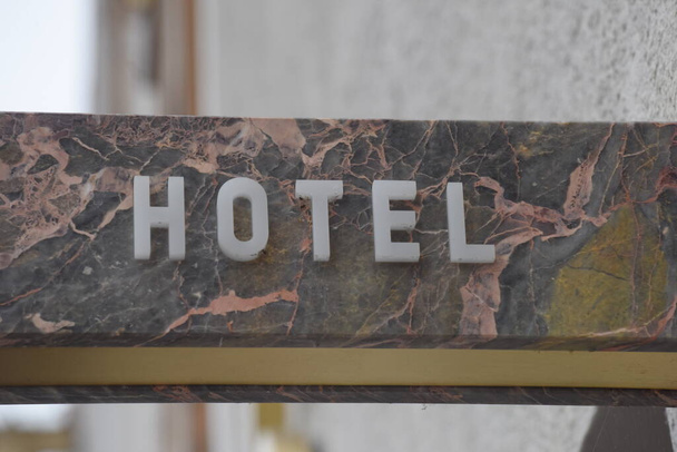 a hotel sign in tourism, overnight stay and guest bed for tourists - Photo, Image