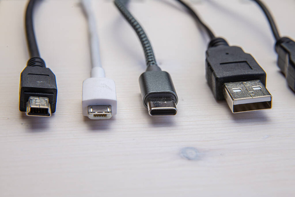 Various types of plugs and cables for audio, video, computer, smartphone and recharging connections. Evolution and change of the types of analog and USB connectors. - Photo, Image