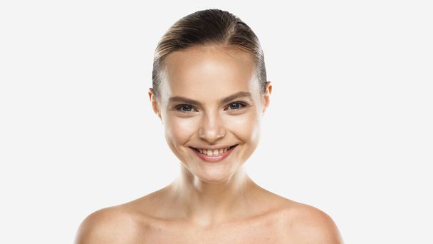 happy young woman with naked shoulders looking at camera isolated on white - Photo, Image