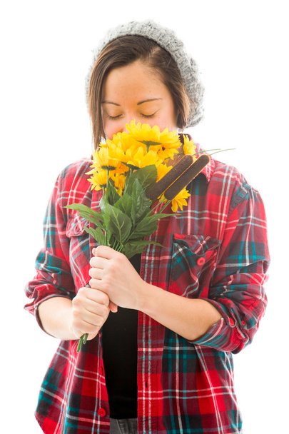 Woman smelling sunflowers - Foto, afbeelding
