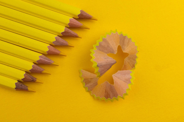 Yellow pencils on yellow background. Vibrant focus. - Photo, Image