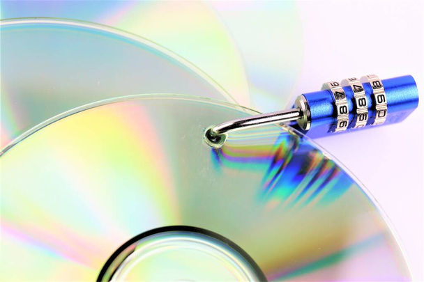 An concept Image of a cd and a lock - data security - Photo, Image