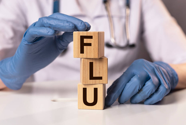 Flu word, inscription in doctor hands. Medical concept. - Photo, Image