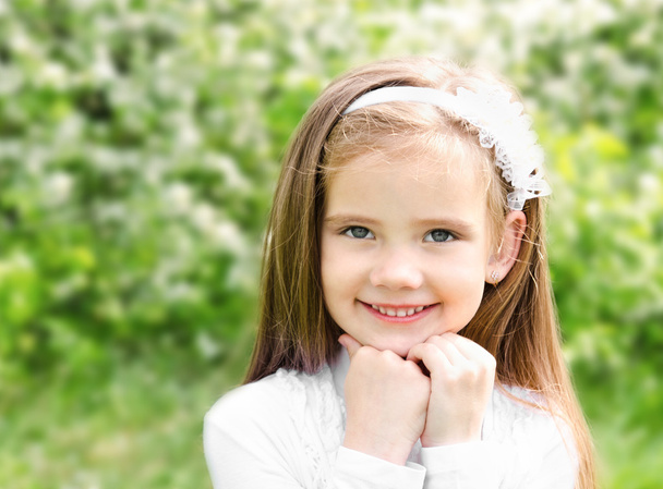 Portrait of adorable smiling little girl - 写真・画像