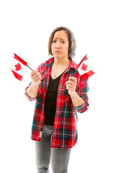 Mujer triste sosteniendo banderas canadienses
 - Foto, imagen
