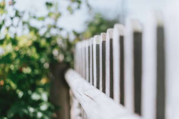 Old gray wooden picket fence - Fotó, kép